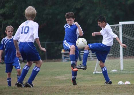 picture kids playing soccer