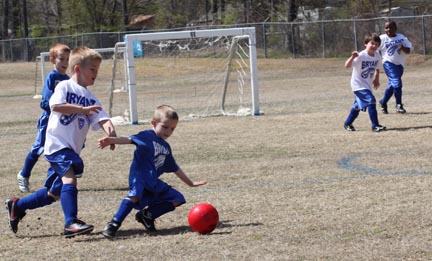 picture kids playing soccer