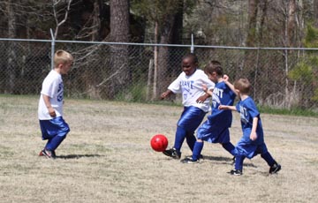 picture kids playing soccer