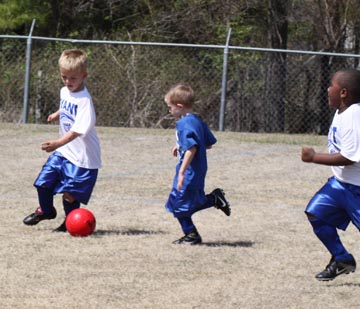 picture kids playing soccer