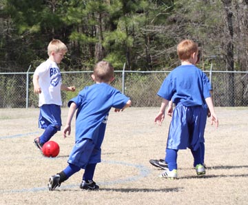 picture kids playing soccer