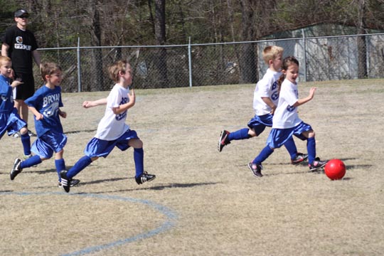 picture kids playing soccer