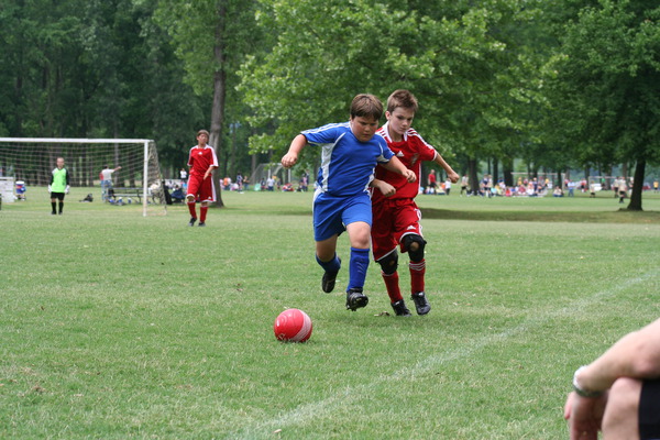 picture kids playing soccer