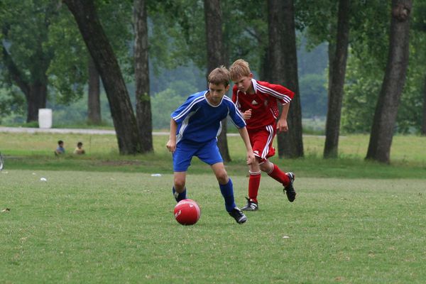 picture kids playing soccer