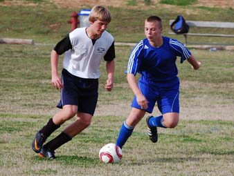 picture kids playing soccer